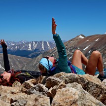 Two girls on the summit of 4316 meters high Mount Democrat with Moun Cameron on the right